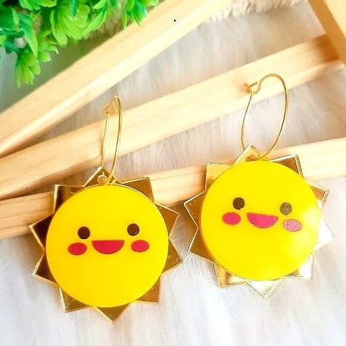 Add a splash of sunshine to any outfit with these beautiful Happy Sun Earrings! Crafted from high-quality yellow and golden acrylic, these earrings feature a cheerful happy face that's sure to brighten any day. Wear them to make a sunny statement and take on the heat of the sun in style!