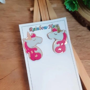 Bring the magic of unicorns to your jewelry collection with these stunning stud earrings. Handcrafted with glossy hotpink and rosegold, these earrings will add a sparkle of enchantment to any outfit. Unlock the power of unicorns and feel the joy of wearing something truly magical!