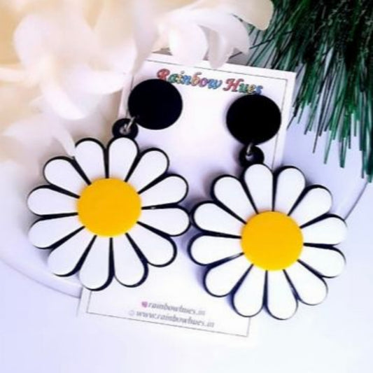 Look radiant this summer with our White Daisy Earrings! Featuring a classic daisy shape, these earrings bring a fresh and cool feel to any ensemble. Show off your light and airy sense of style with these unique and beautiful earrings!