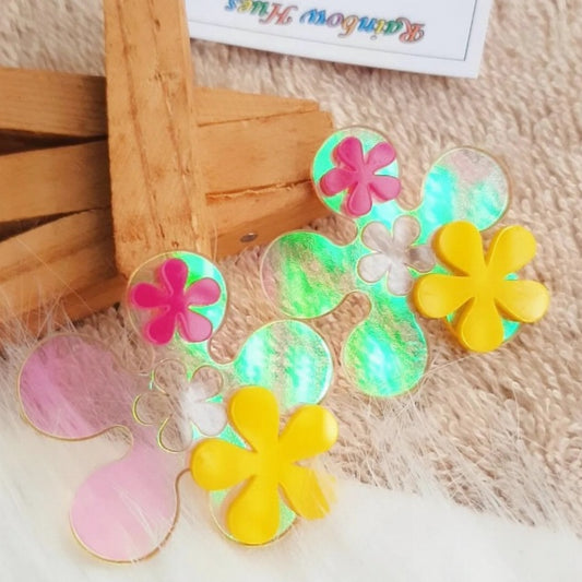These Flower Power Earrings will brighten up any look with their unique holographic shimmer and show-stopping combination of yellow and pink flowers. Perfect for making a bold statement, these earrings will give you the magical confidence to create your own fairytale.