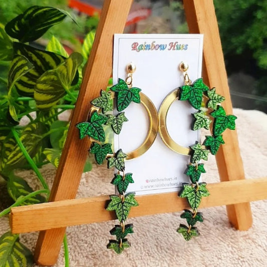 Gorgeous and glamorous, the Ivy Leaf Earrings will make you feel as elegant and mesmerizing as the vines they represent. Sparkling light and dark green Ivy leaves, gracefully intertwined in a glossy golden wreath, will add an emotional touch of allure to your look. Feel the beauty and become the embodiment of chic with these stunning earrings!