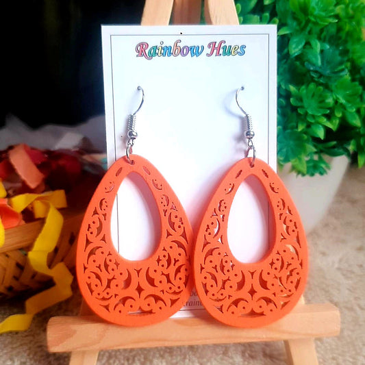 Be stylishly unique and treat yourself to these distinctly designed orange wooden trellis earrings. Super lightweight and comfortable to wear, these earrings are sure to make a statement and turn heads. Add a bright pop of color to your wardrobe with these unique earrings today!