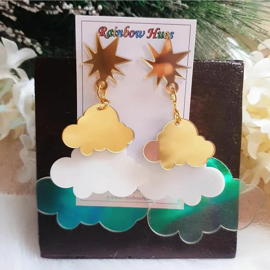 Take your fashion to new heights with the Tri-Thundercloud Earrings! A unique combination of golden, white, and holographic elements creates a blast of captivating shine and shimmer. Guaranteed to take your outfit from boring to beautiful in an instant! Perfect for bold, daring fashion lovers!