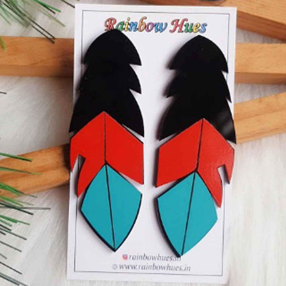 Unleash your fashionista side with these unique Rio Feather Earrings. Their trendy black, red and sea green feathers make them an accessory to be seen with. Lightweight and eye-catching, they make the perfect statement! Get the look now!