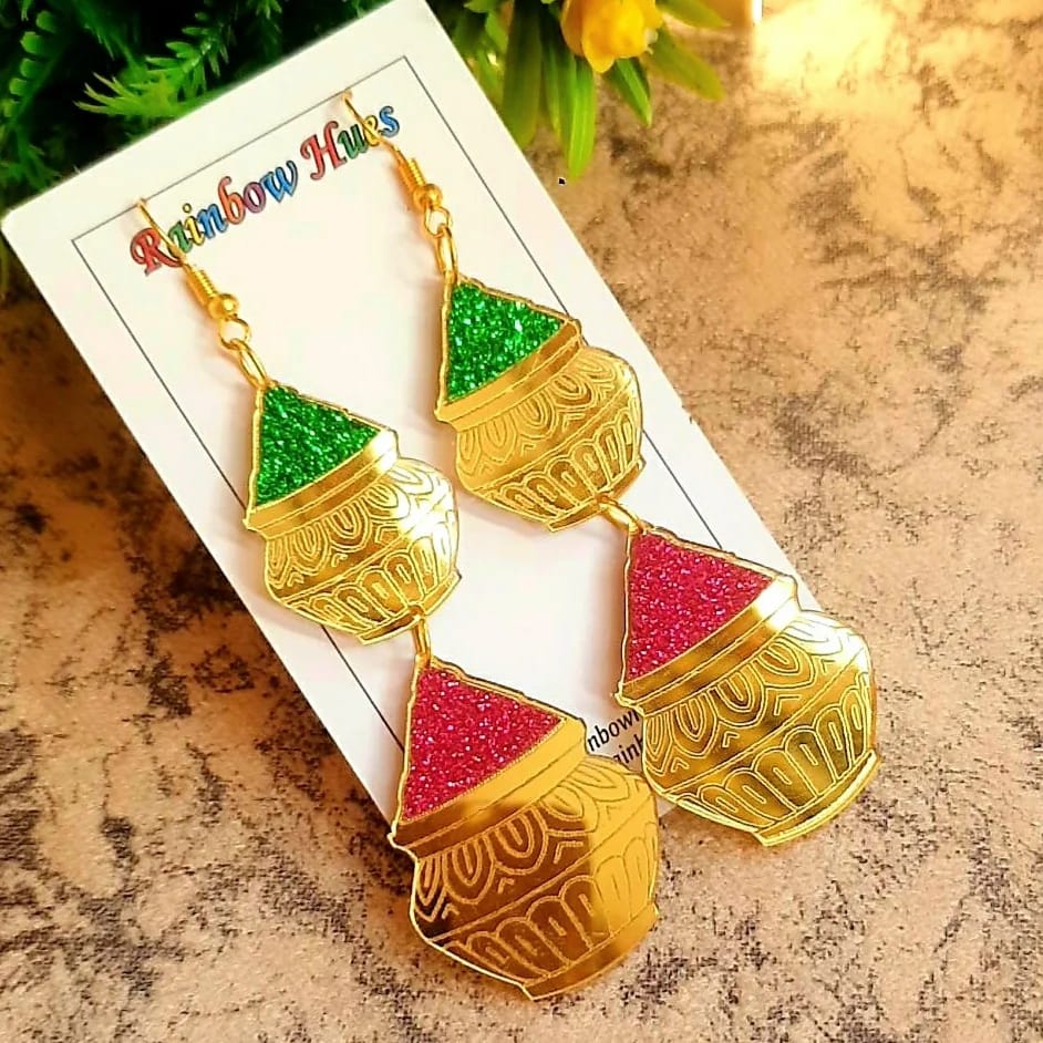 Experience stylish elegance with our Gulal Matka Earrings! These statement earrings feature vibrant shades of pink, green and mirror gold giving you an eye-catching accessory to spice up your traditional wardrobe. You'll love the lightweight feel of these earrings. Create unforgettable looks with our Gulal Matka Earrings!