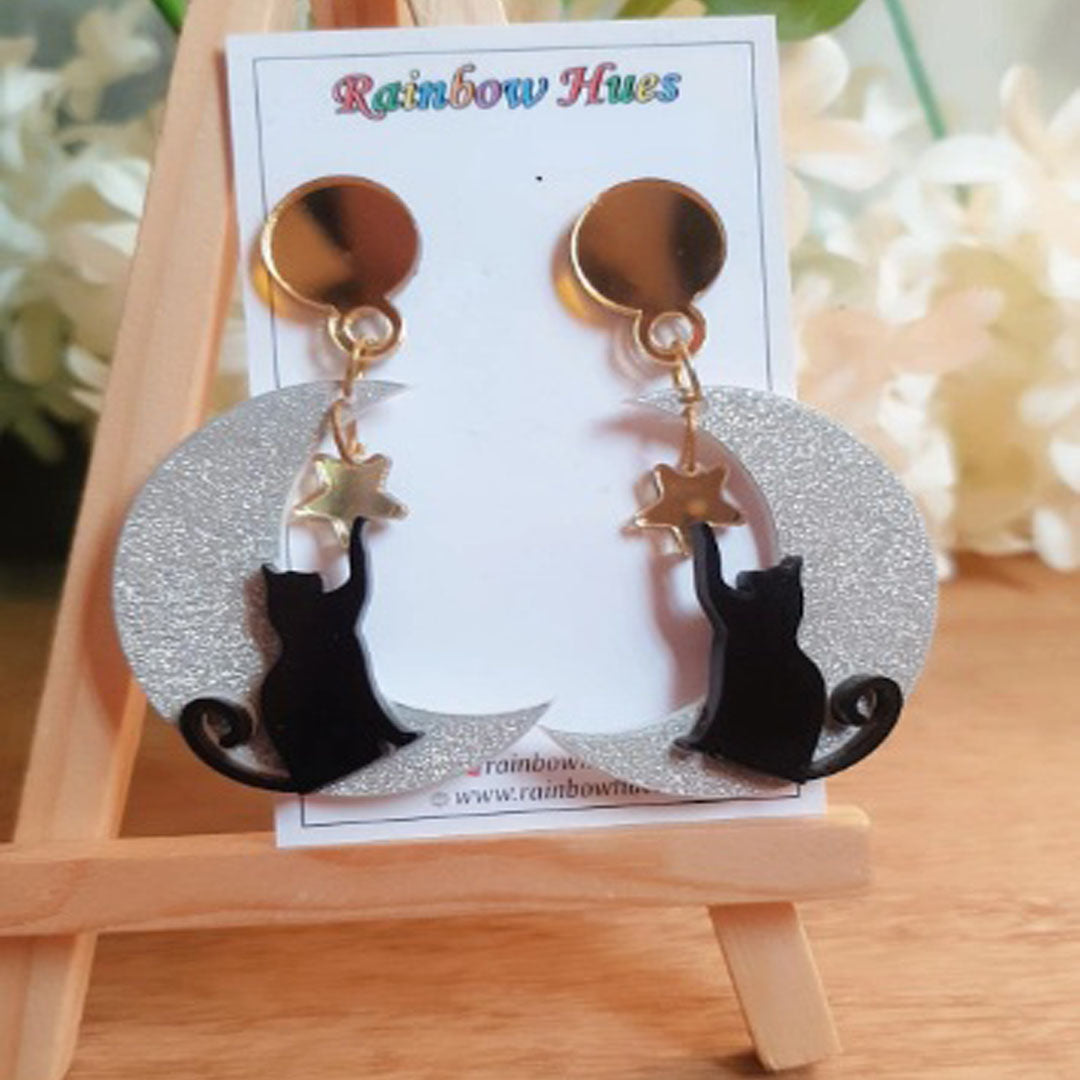 Add a touch of playful fun to your outfit with these stunning Playful Kitty Earrings! Show your adoration for cats and express your unique style with this captivating silver jewelry. Enjoy the compliments when you wear this eye-catching accessory - perfect for any occasion!