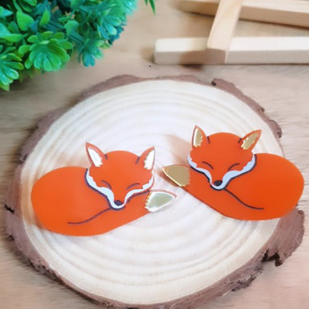 Enliven your look with these beautiful Sleeping Fox Earrings! Crafted with intricate detail, these earrings are sure to become a treasured favorite. Show off your wild side with these unique and captivating earrings - you don't want to miss out!