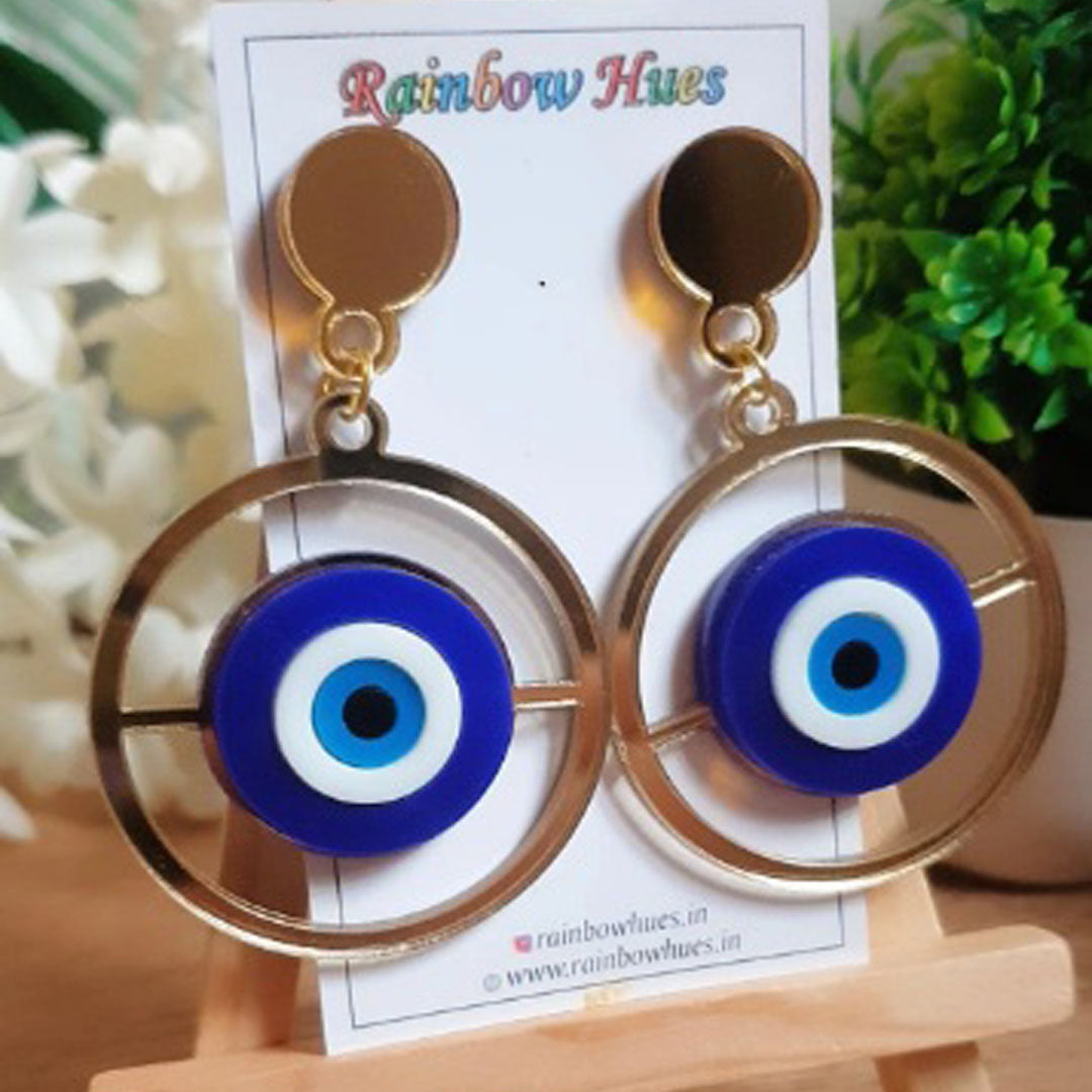 Shield yourself in style with these stylish Evil Eye Danglers. Featuring bold, vivid colors and intricate design, these statement earrings can add a dash of charm and protection to any outfit. Shield yourself from misfortune and look good doing it!