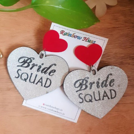 Be part of the bride squad with these beautiful Silver Bride Squad Earrings. Carefully crafted with silver glitter, these earrings will be the perfect accent to your outfit. Show your love and support for any special occasion with these chic and stylish earrings. Glam up any event!