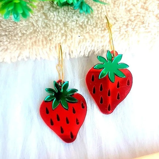 Light up any outfit this summer with these Glossy Strawberry Earrings! Crafted with high quality glossy red acrylic and mirror green leaves, these earrings will add a hint of glamour and shine to your look. Super cute and chic, they'll make you stand out in any crowd.