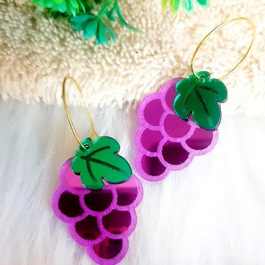 Make a statement with these eye-catching Glossy Grapes Earrings! Crafted with glossy purple acrylic grapes and mirror green leaves, these earrings will be the perfect addition to your summer look. With their high-quality design and playful appeal, you can shine like a star wherever you go! 