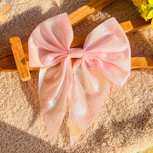This Pink Holographic Bow is the perfect accessory for any outfit. Its unique, holographic finish sparkles in the light, creating an eye-catching look that will turn heads wherever you go. Wear it confidently and show off your unique style with this beautiful shimmery bow!