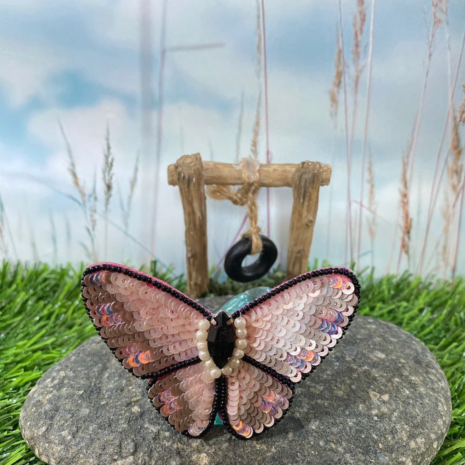 Add a touch of extra glamour to any hairstyle with our handmade sequin butterfly hairclip. Crafted with beautiful pink sequins, it catches the light beautifully for a glamorous touch. Versatile and lightweight, it's perfect for any occasion.