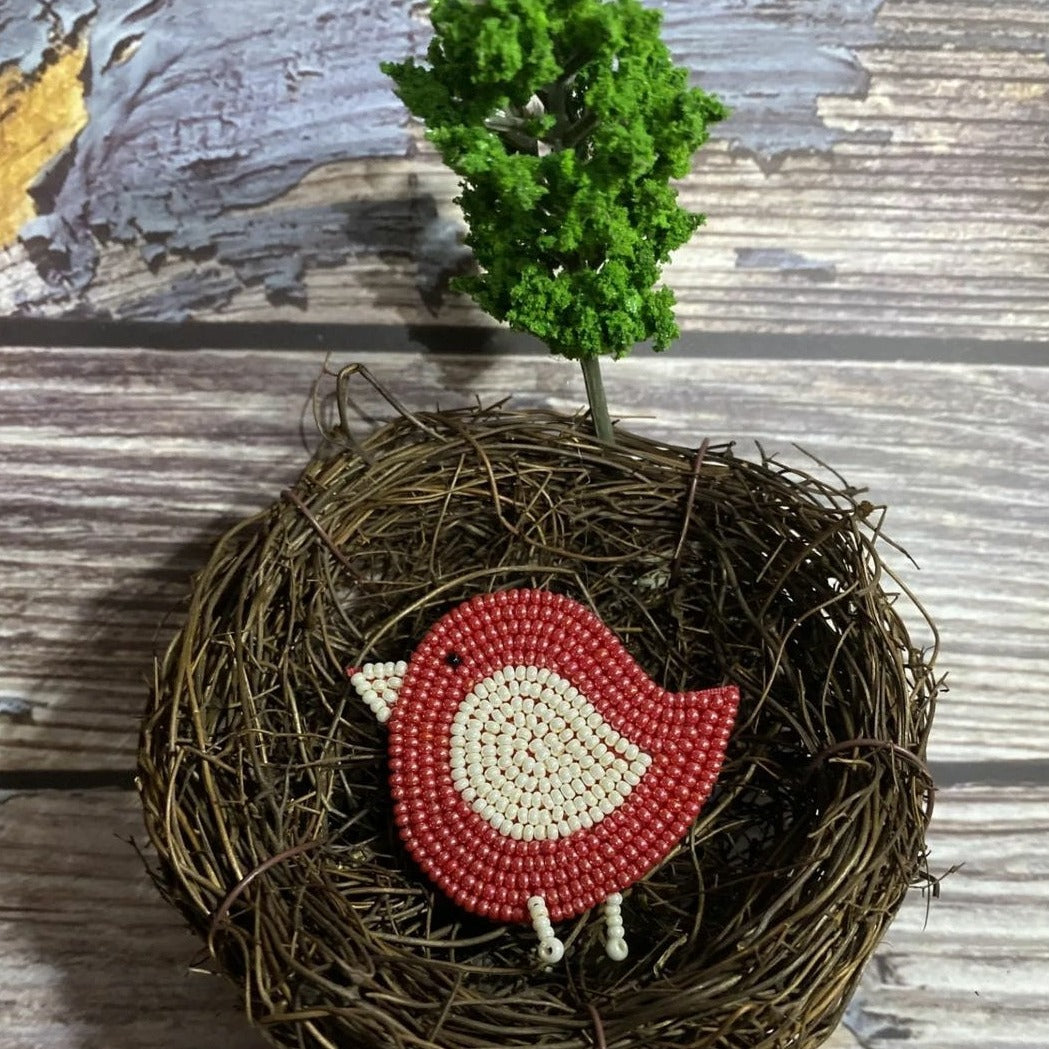 This handmade red beaded birdie hairclip adds a vibrant pop of color to any hairstyle. The bird is crafted from beading techniques used by artisans, so you can be sure the quality is superb. Fasten your look with this unique and stylish accessory for a look that will turn heads.