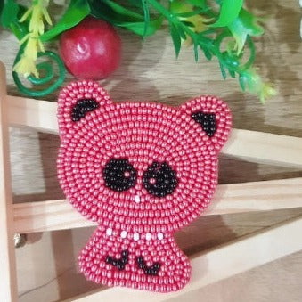 Add a touch of whimsy to your hairstyle with this handmade red beaded kitty hairclip. Crafted with care, the hairclip features a 1 piece design with intricate beading and a unique kitty shape to elevate your look. Perfect for all occasions.