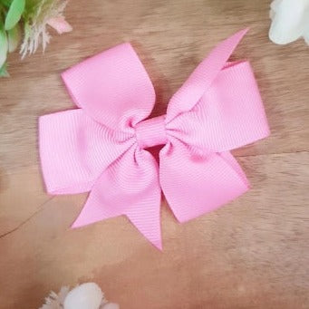 Your little one will look absolutely adorable with this Baby Pink Bow Clip! The pretty pink bow is made of high-quality material and secured with a strong alligator clip, providing a secure and stylish look that will last. Perfect for special occasions or everyday wear!