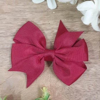 Instantly add a touch of elegance to your hair with this attractive Wine Bow Clip. Adorned with a pretty wine-colored bow, the clip secures comfortably with an alligator clip. Enjoy easy, hassle-free style in a snap!