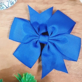 This gorgeous blue bow clip is the perfect accessory for any occasion! Crafted with an alligator clip, this bow securely holds the hair in place. With its classic bow shape, it adds a chic and pretty touch to any outfit.