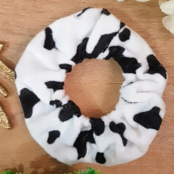 Moo Scrunchie combines cute black and white style with soft comfort. Its elastic material provides the perfect amount of stretch to keep your hair in place, making it ideal for any hair type. Get the perfect look and all-day comfort with Moo Scrunchie.