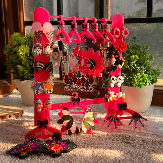 Organize your jewelry in style with this Hot Pink Jewellery Organizer. Designed to store your Earrings and Studs, this organizer is perfect for practical and fashionable storage. With its beautiful hot pink hue, it's sure to bring a bold flair to your bedroom decor!