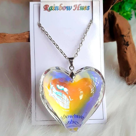 Bring a bit of magic to your life with this dazzling Rainbow Fairy Heart Necklace. With an eye-catching pendant that reflects the colors of the rainbow, this necklace will give you a unique, one-of-a-kind look perfect for any occasion! Dare to add a little sparkle to your day!