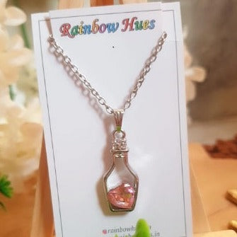 Show your love with this romantic Pink Love Bottle Necklace! Handcrafted in sterling silver and featuring a pink stone heart, this unique necklace is perfect for gifting to that special someone. Let your heart sparkle with this one-of-a-kind necklace!