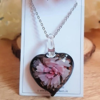 Make a statement with this stunning Pink Floral Heart Glass Necklace! Crafted of glass and detailed with a pink flower, this handmade necklace will be the perfect addition to any outfit. Get your one-of-a-kind, unique piece today!