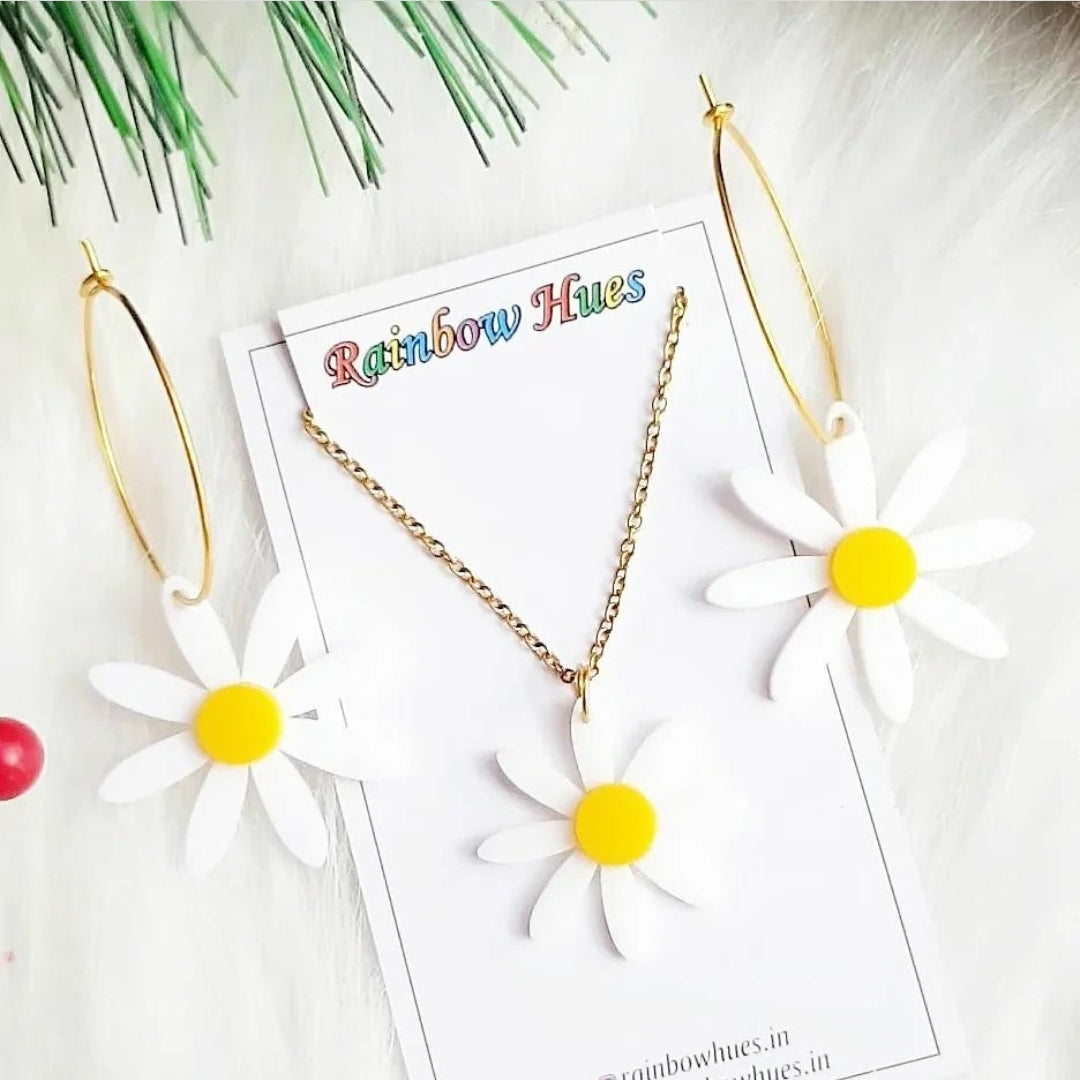This White Daisy Set is a stunning accessory for any occasion. The set includes a necklace and matching earrings, each with beautifully crafted white daisies. The earrings are packaged separately for safety, and easy to assemble. Add a touch of delicate elegance to your wardrobe with this set.