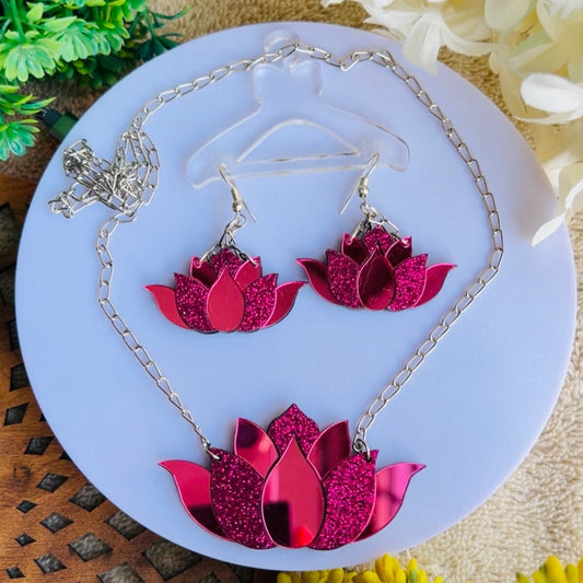 This Lotus Set features a delicate necklace and earrings, both crafted with exquisite detail. The intricate design of the jewelry will add a timeless essence to any look. Perfect for everyday wear or special occasions, this set is sure to become a favorite.