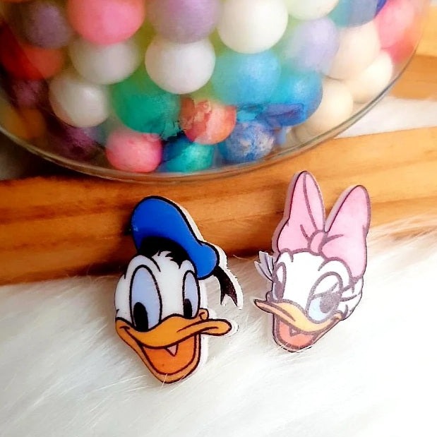 Treat yourself or a loved one to these charming Donald and Daisy Duck Stud Earrings and show off your Disney spirit. A super cute pair of mismatched Donald and Daisy Duck Earrings. Make an ear-catching statement with these gorgeous Disney accessories!