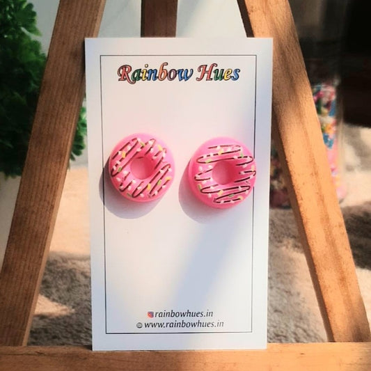 Add a tasty twist to your look with these delightful Strawberry Doughnut Stud Earrings! Scrumptious and stylish, these earrings will make any outfit look even sweeter. Indulge yourself and your sense of style with these sweet treats!