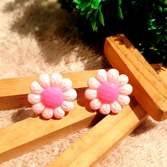 Make a statement and show your personality with these beautiful pink daisy stud earrings. Crafted with care, these earrings are the perfect accessory to make any look stand out. Radiating femininity, these lovely earrings will bring out your natural beauty and complete any outfit you desire. Get them now!