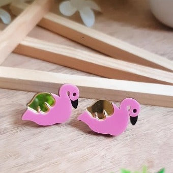 Be the ultimate chic with these Swan Stud Earrings! Each earring is uniquely crafted with a mix of pretty pink and mirror golden for a sophisticated and stylish look. Sure to add a touch of glamour to any outfit!