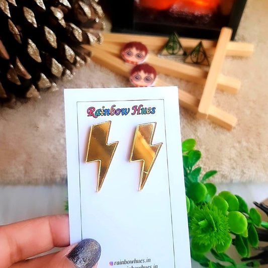 Enchant your look with these Harry Potter Scar Stud Earrings. Crafted in glossy golden lightweight acrylic, these lightening bolt scar earrings will bring a hint of magic to your day! Perfect for any Harry Potter fan!